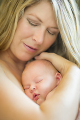 Image showing Young Beautiful Mother Holding Her Precious Newborn Baby Girl