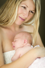 Image showing Young Beautiful Mother Holding Her Precious Newborn Baby Girl