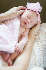 Image showing Hands of Mother Holding Her Newborn Baby Girl