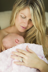 Image showing Young Beautiful Mother Holding Her Precious Newborn Baby Girl