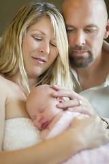 Image showing Beautiful Young Couple Holding Their Newborn Baby Girl