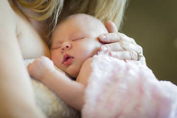 Image showing Hands of Mother Holding Her Newborn Baby Girl