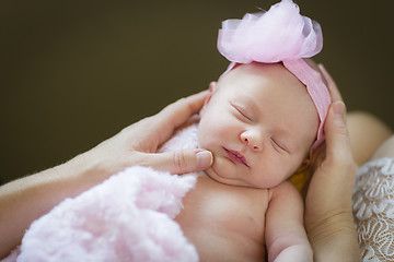 Image showing Hands of Mother Holding Her Newborn Baby Girl