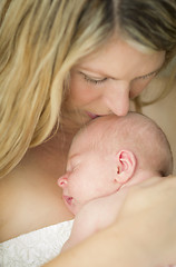 Image showing Young Beautiful Mother Holding Her Precious Newborn Baby Girl