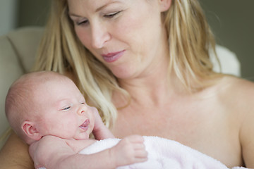 Image showing Young Beautiful Mother Holding Her Precious Newborn Baby Girl