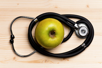 Image showing Stethoscope and apple