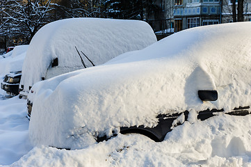 Image showing vehicles covered with snow