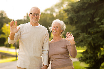 Image showing senior couple hugging in city park