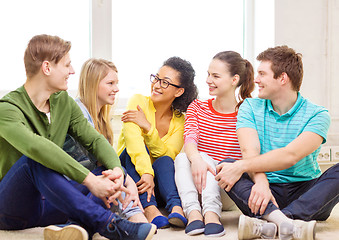 Image showing five smiling teenagers having fun at home