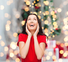 Image showing smiling woman in red dress