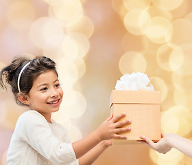 Image showing smiling little girl with gift box