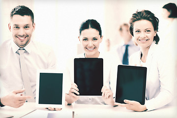 Image showing business team showing tablet pcs in office