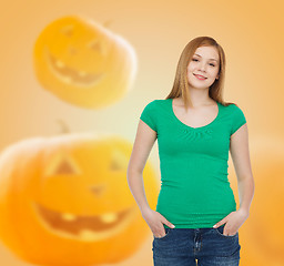 Image showing smiling young woman in blank green t-shirt