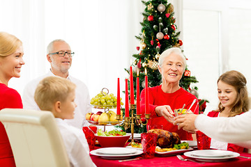 Image showing smiling family having holiday dinner at home