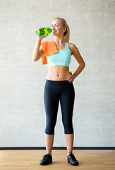 Image showing woman with bottle of water in gym