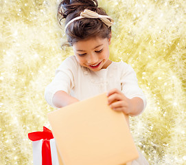 Image showing smiling little girl with gift box