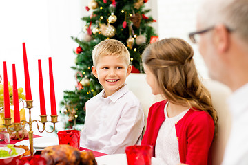 Image showing smiling family having holiday dinner at home