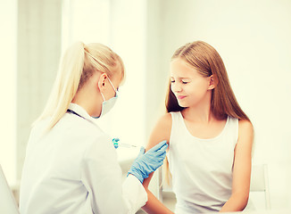 Image showing doctor doing vaccine to child in hospital