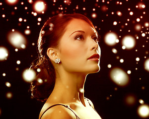 Image showing woman in evening dress wearing diamond earrings