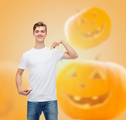 Image showing smiling young man in blank white t-shirt