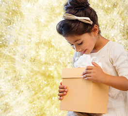 Image showing smiling little girl with gift box