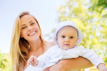 Image showing happy mother with little baby in park