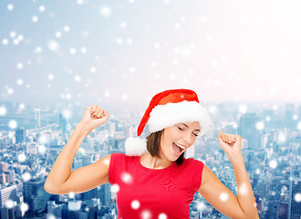 Image showing smiling woman in santa helper hat