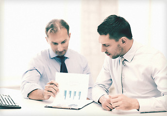 Image showing businessmen with notebook on meeting