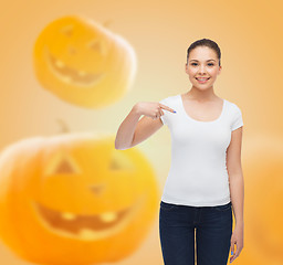 Image showing smiling young woman in blank white t-shirt