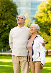 Image showing senior couple hugging in city park