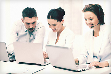 Image showing group of people working with laptops in office