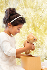 Image showing smiling little girl with gift box