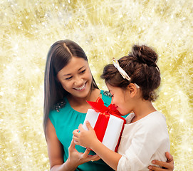 Image showing happy mother and little girl with gift box