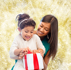 Image showing happy mother and little girl with gift box