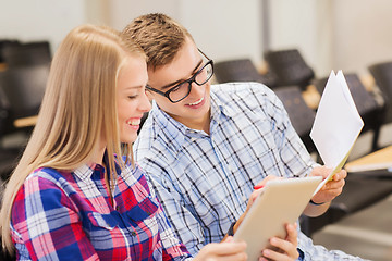 Image showing group of smiling students with notebooks