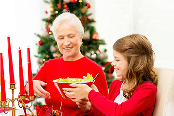 Image showing smiling family having holiday dinner at home