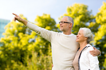 Image showing senior couple hugging in park