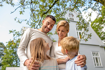 Image showing happy family in front of house outdoors