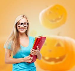 Image showing smiling student girl with books and backpack