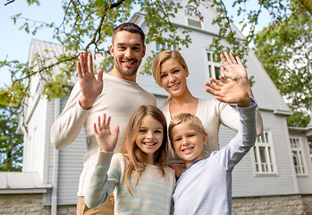 Image showing happy family in front of house outdoors