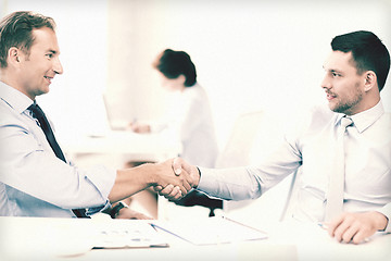 Image showing businessmen shaking hands in office