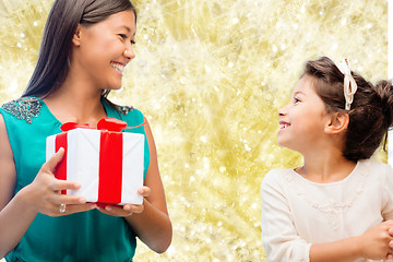 Image showing happy mother and little girl with gift box