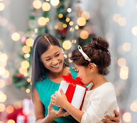 Image showing happy mother and little girl with gift box