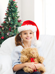 Image showing smiling little girl with teddy bear