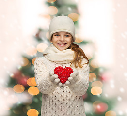 Image showing girl in winter clothes with small red heart