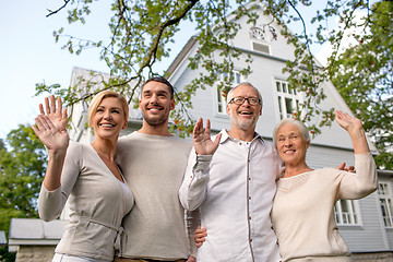 Image showing happy family in front of house outdoors