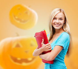 Image showing smiling student girl with books and tablet bag