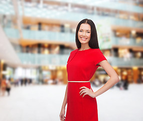 Image showing smiling woman in red dress