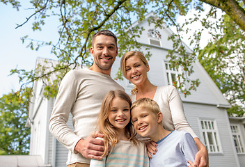 Image showing happy family in front of house outdoors