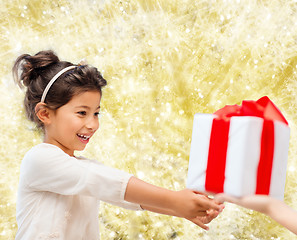 Image showing smiling little girl with gift box